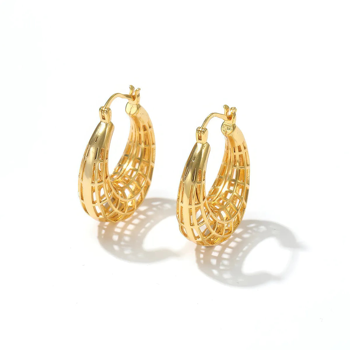 Gold hoop earrings on a white background. #Style_B