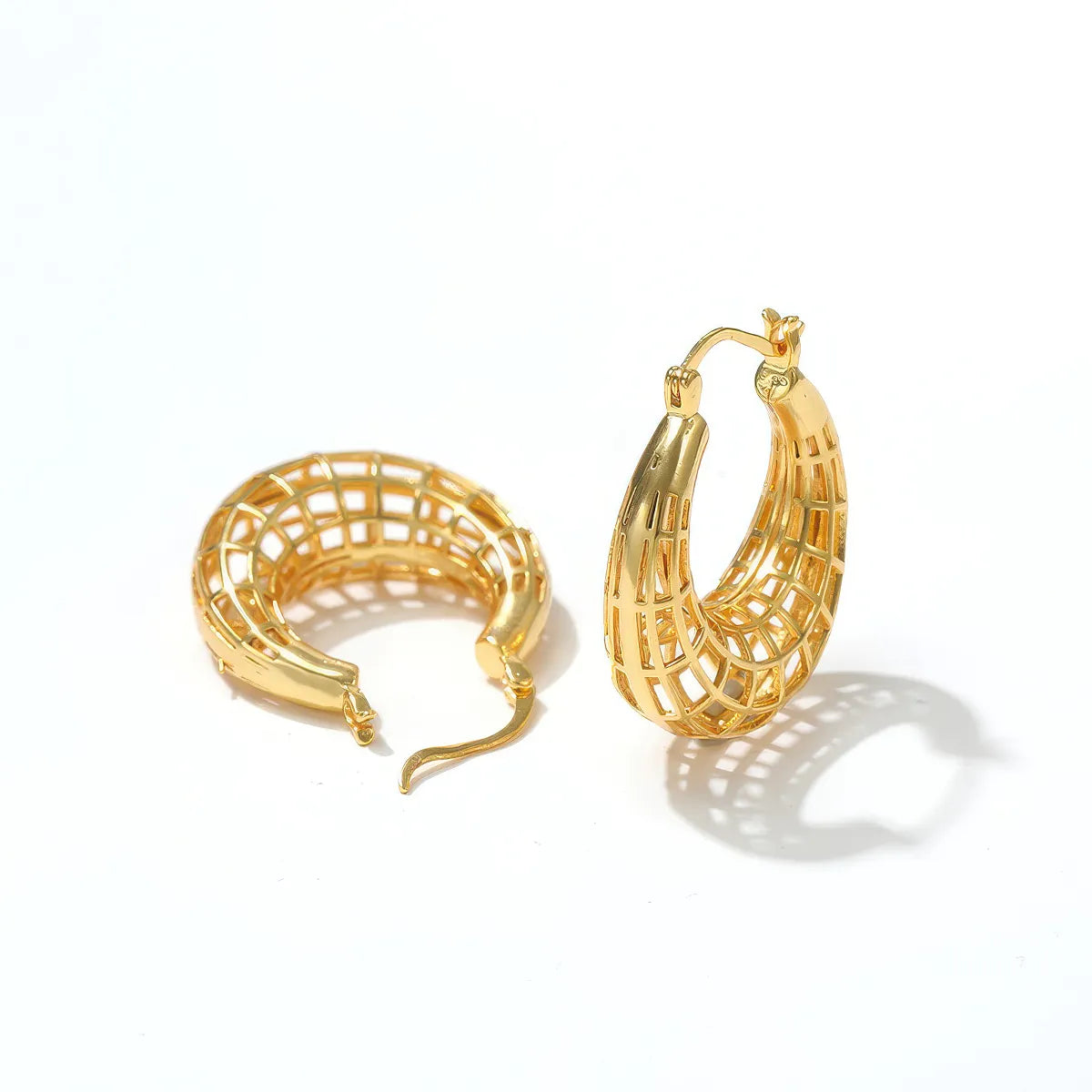 Gold hoop earrings on a white background. #Style_B