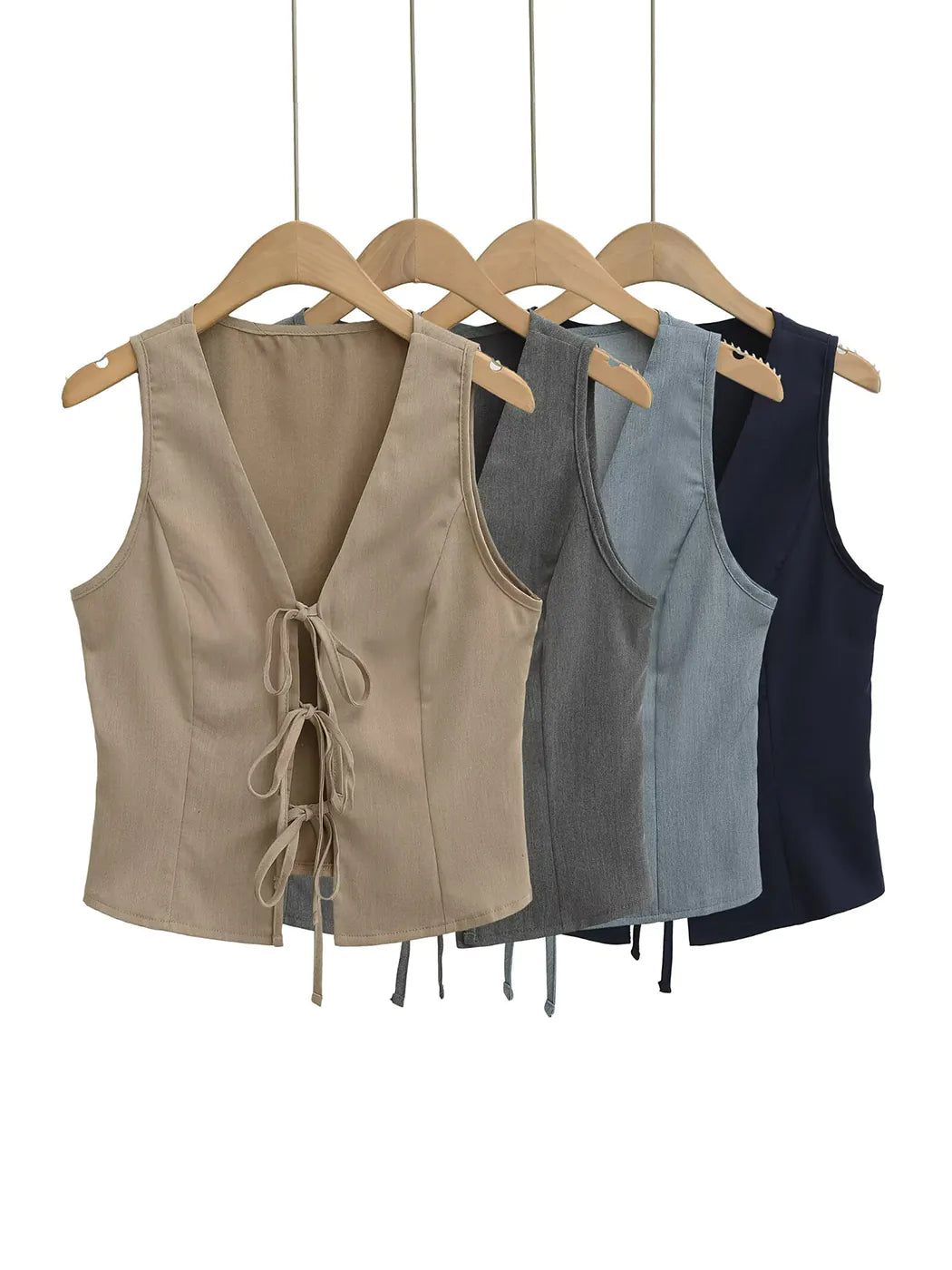 Four sleeveless tops in beige, gray, and navy on hangers against a white background #Color_LightGray