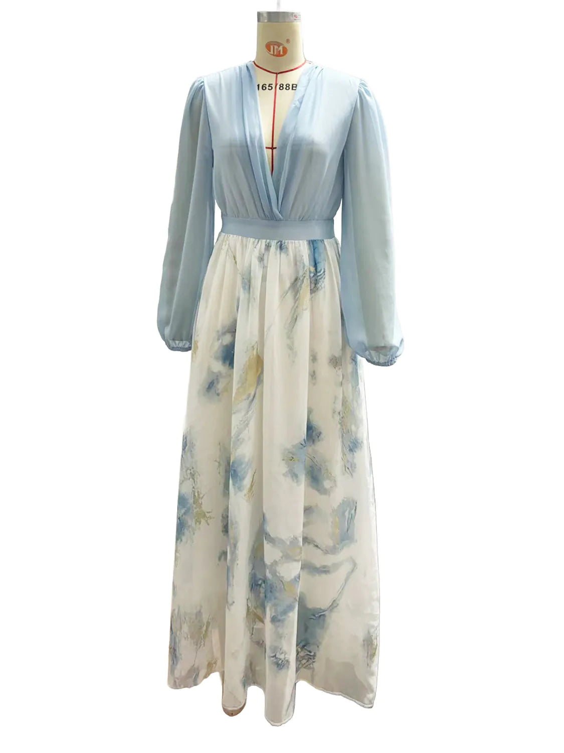 Light blue top and white floral skirt on a mannequin against a white background
