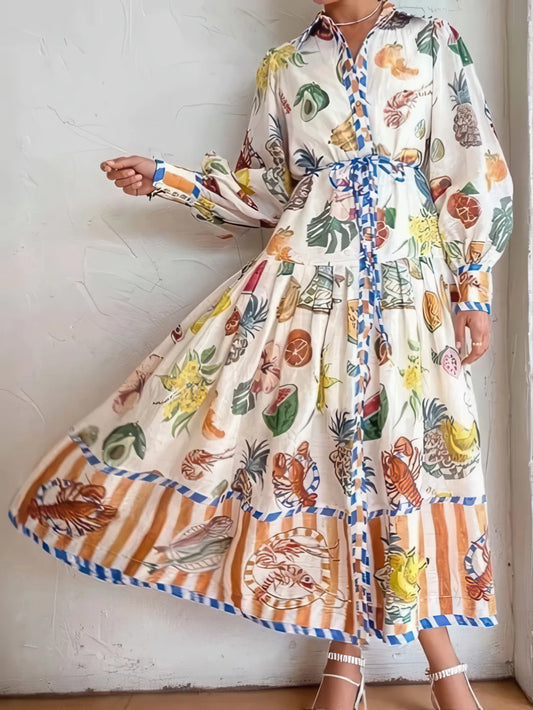 Person wearing a colorful floral and striped dress against a white wall. #Color_White