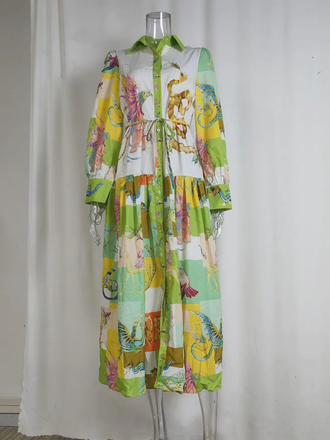 Colorful floral dress on a mannequin against a white curtain background. #Color_LightGreen