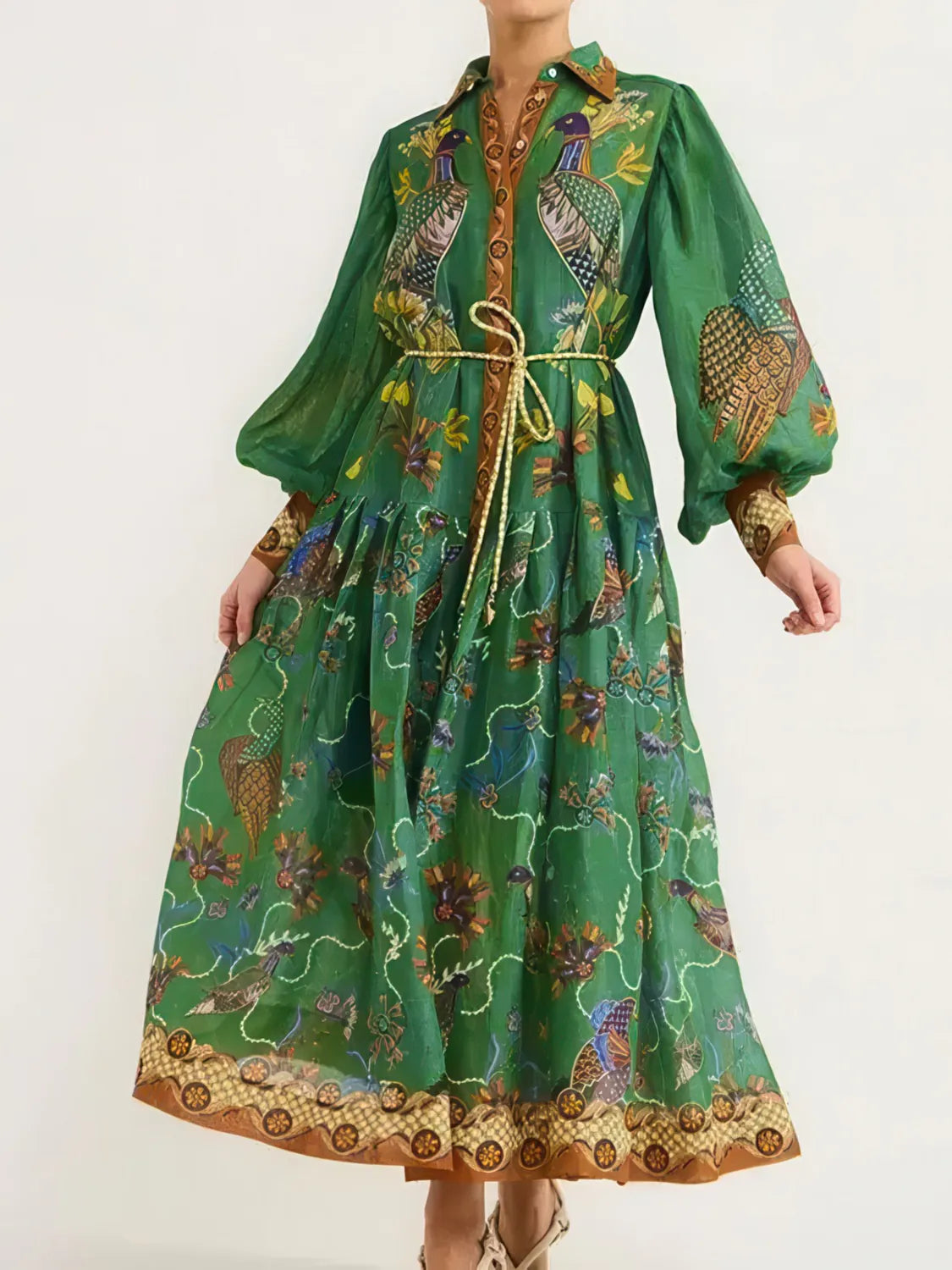 Green patterned dress with a white background. #Color_Green