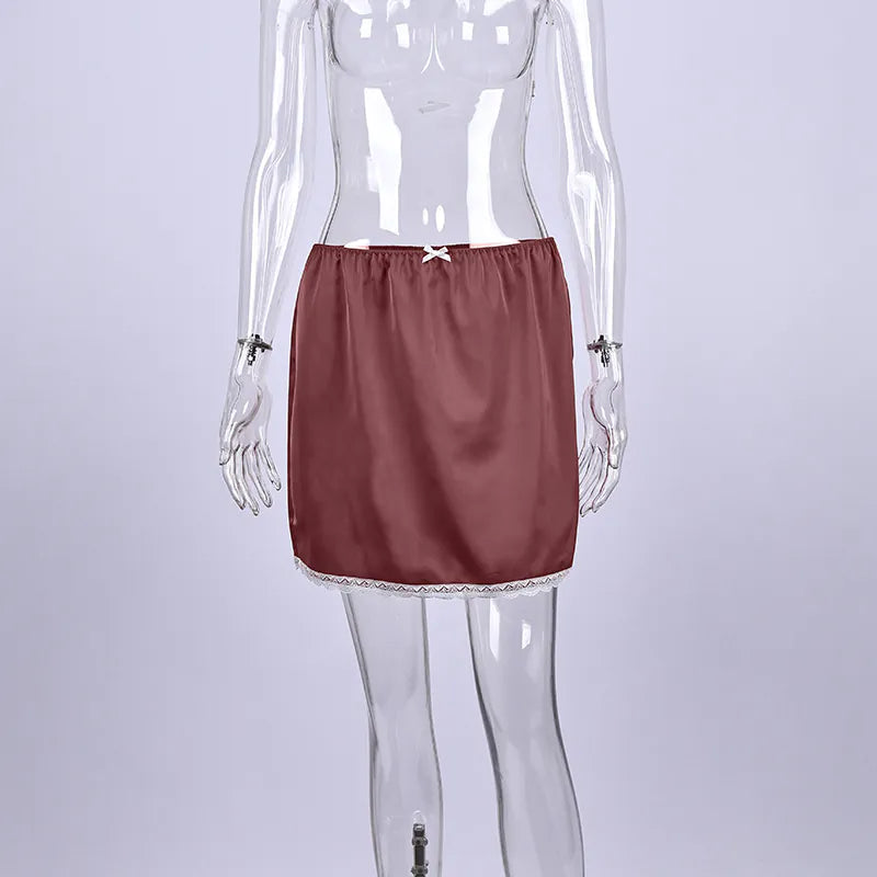 Red satin skirt on a transparent mannequin against a light gray background. #Color_Red