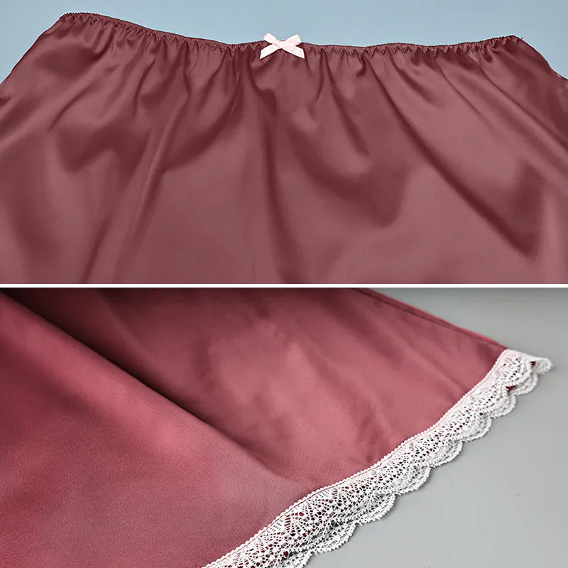 Maroon satin petticoat with lace trim on a gray background. #Color_Red