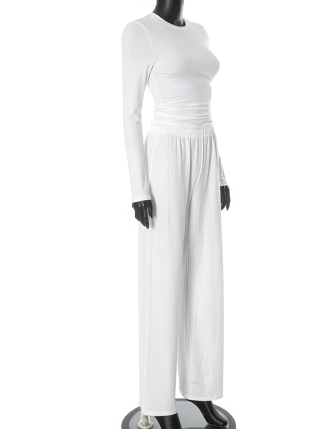 White dress on a mannequin against a white background. #Color_White