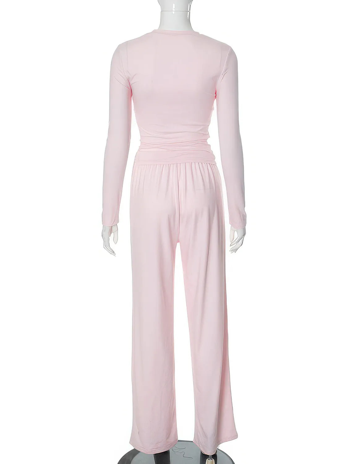 Pink jumpsuit on a mannequin against a white background. #Color_Pink